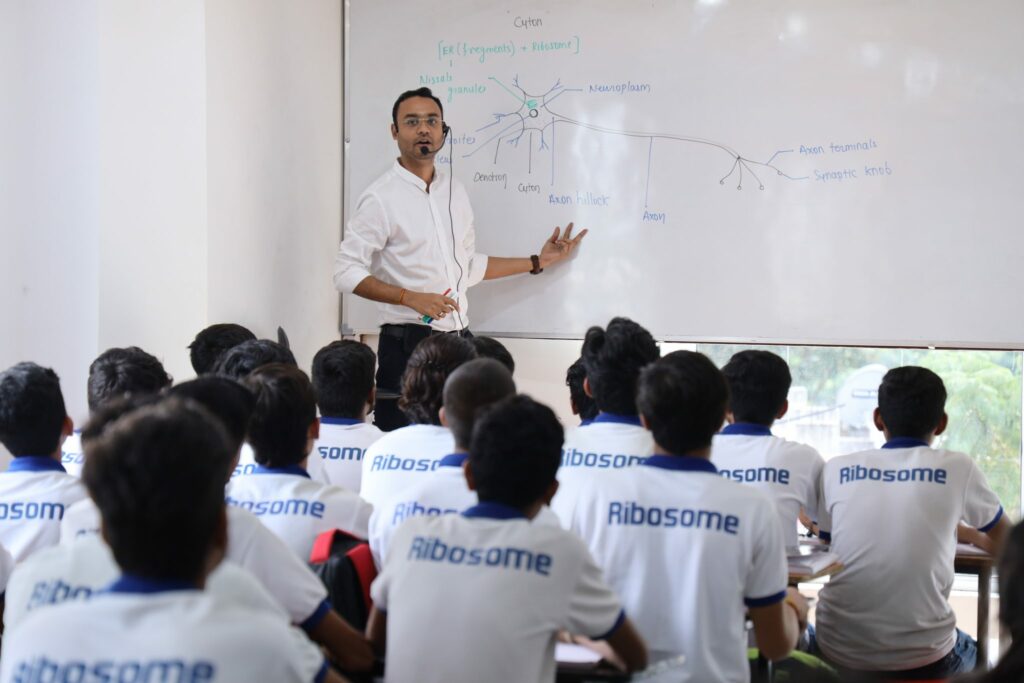 NEET coaching classroom with students studying